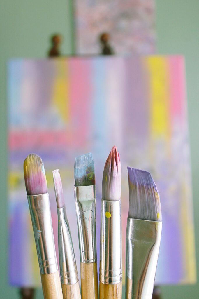 pexels-photo-1646953-1646953 Art brushes with abstract painted canvas in vibrant colors.